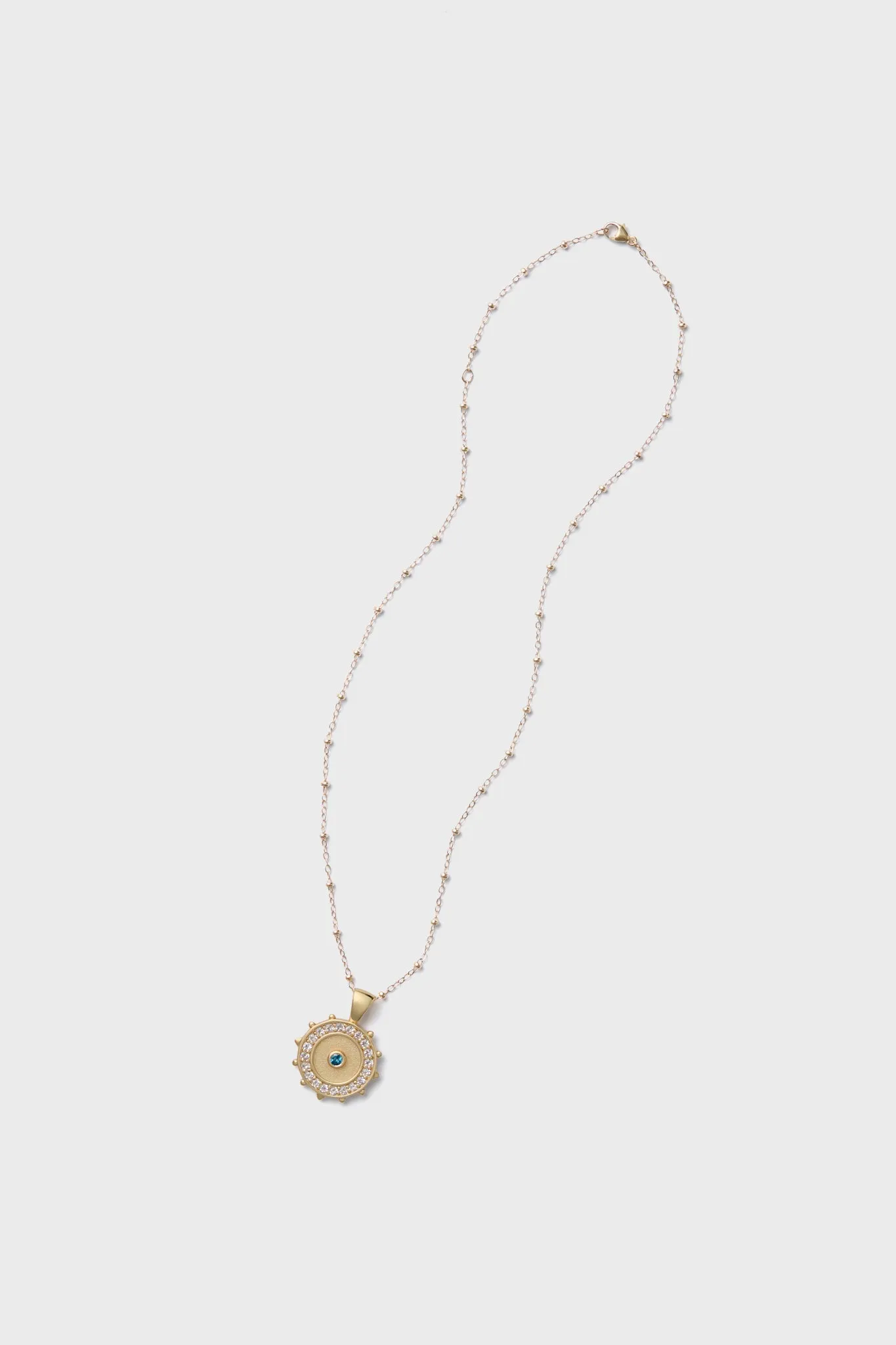 Gold Protect Watchful Eye Pendant sold by Tuckernuck