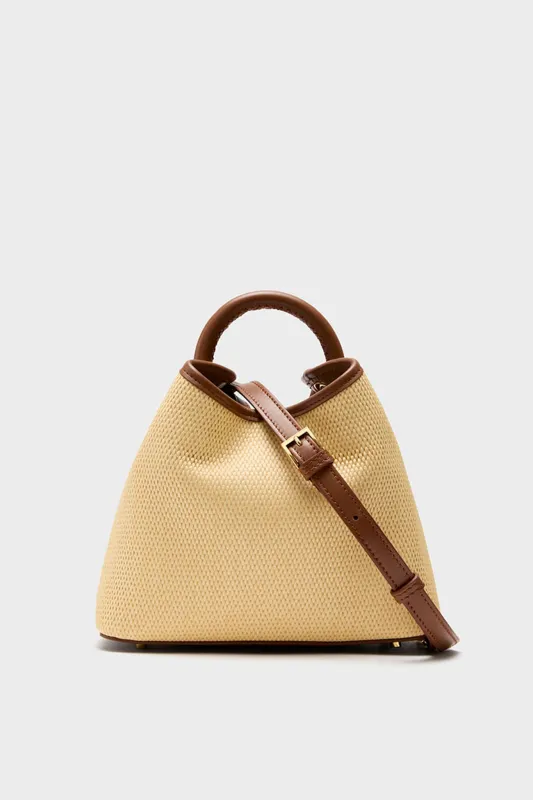 Natural and Cognac Raffia Baozi Bag sold by Tuckernuck