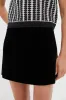 Black Velvet Grace Mini Skirt sold by Tuckernuck
