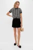 Black Velvet Grace Mini Skirt sold by Tuckernuck