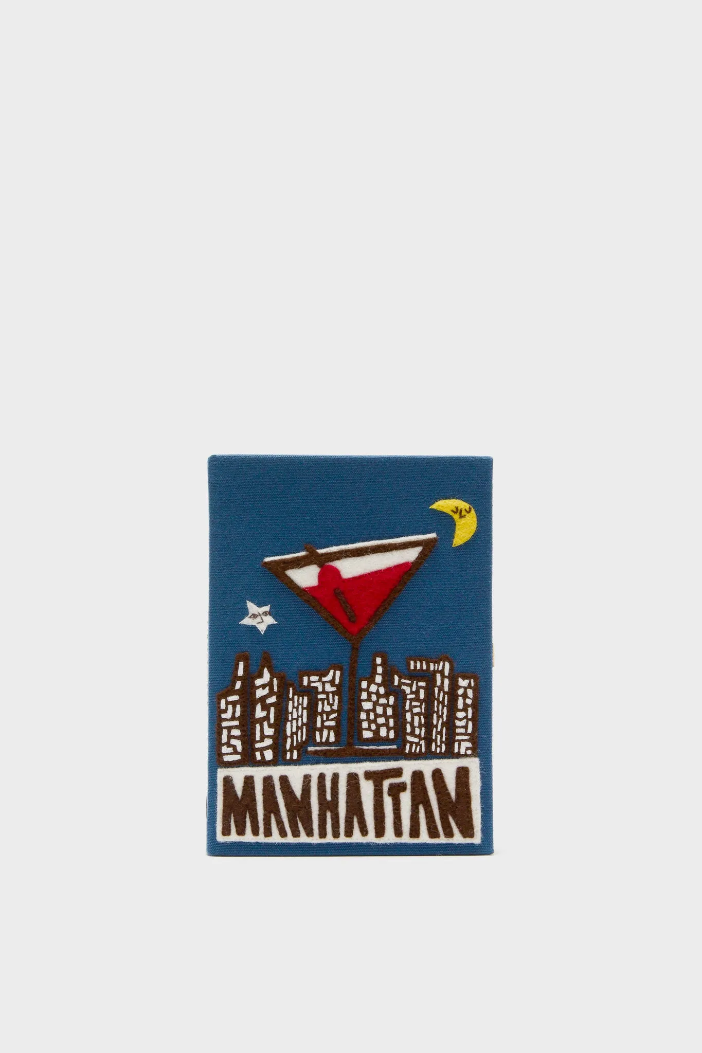 Indigo Latim Manhattan Cocktail Book Clutch sold by Tuckernuck