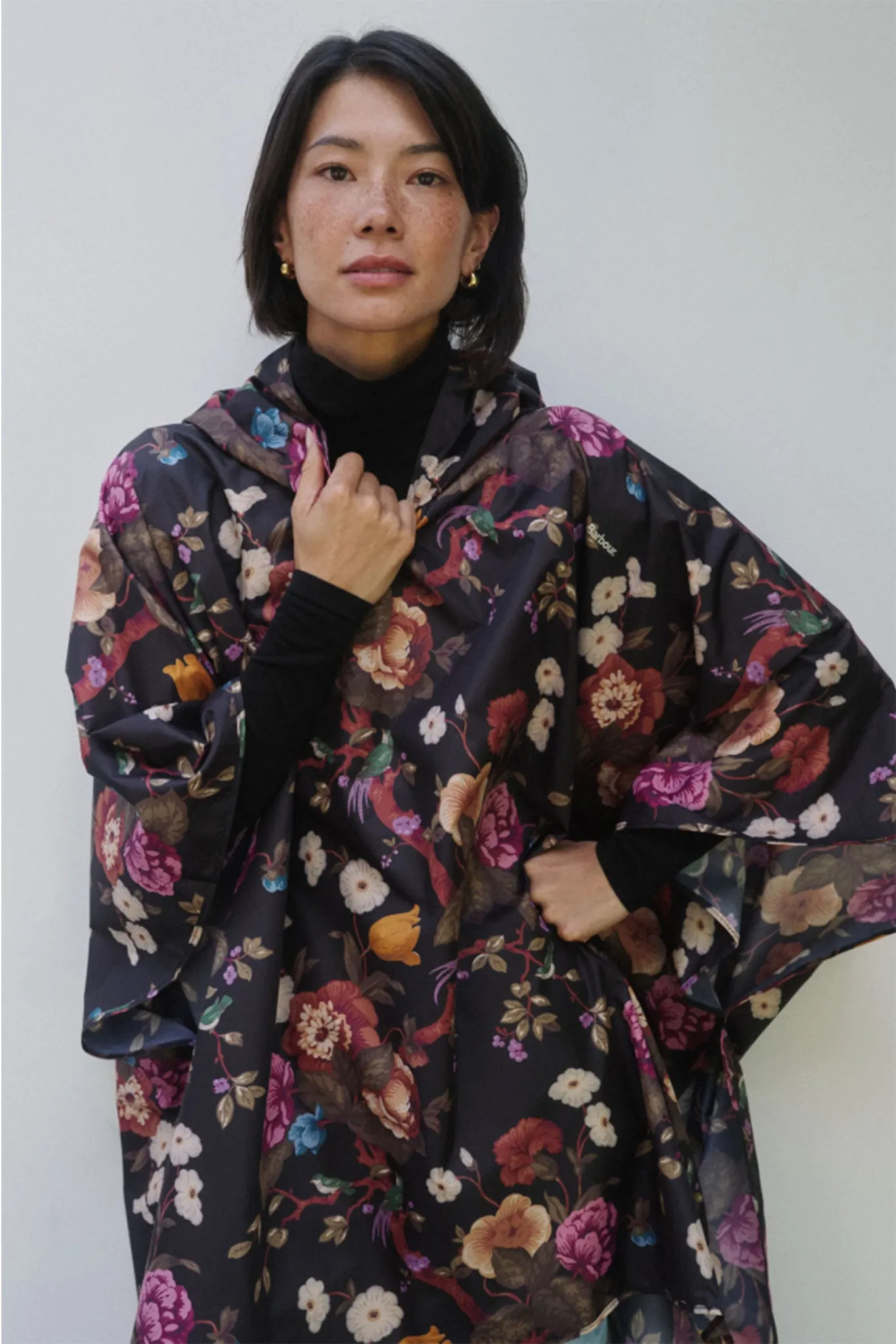 Black Floral Barbour x Tuckernuck Poncho sold by Tuckernuck