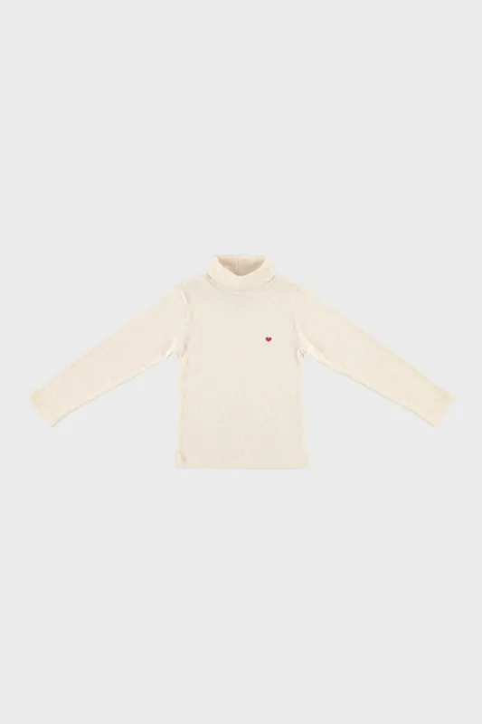 Bebe Heart Turtleneck sold by Tuckernuck