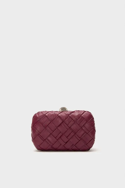 Burgundy Haven Woven Clutch sold by Tuckernuck