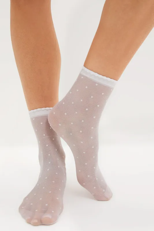 White Sheer Polka Dot Socks sold by Tuckernuck