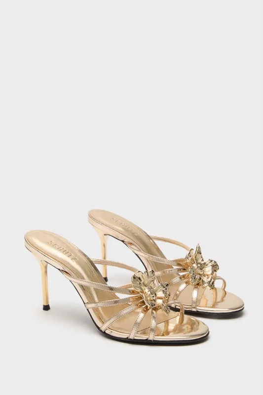 Platina Flora Mules sold by Tuckernuck