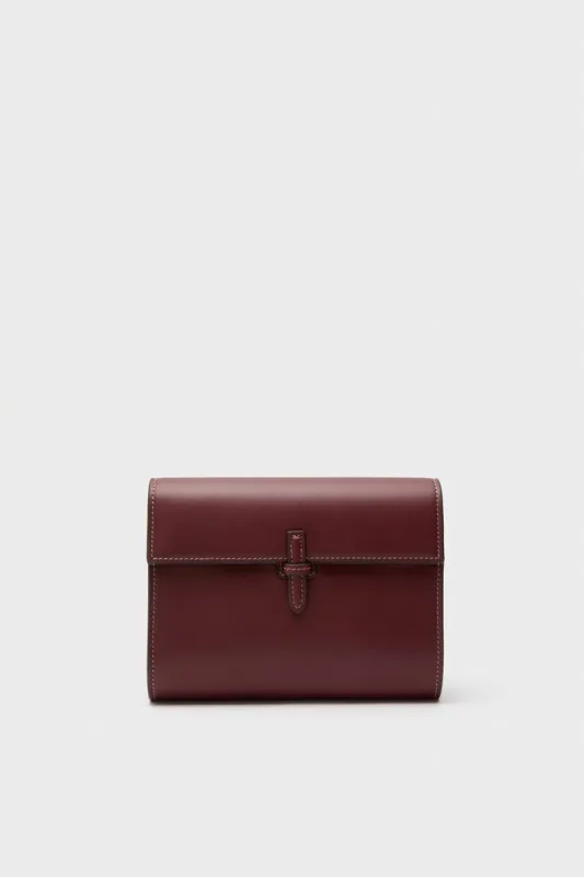 Burgundy Small Soft Napa Clutch sold by Tuckernuck