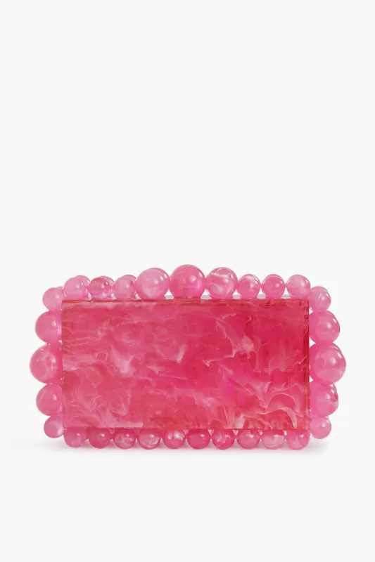 Qajar Rose Eos Clutch sold by Tuckernuck