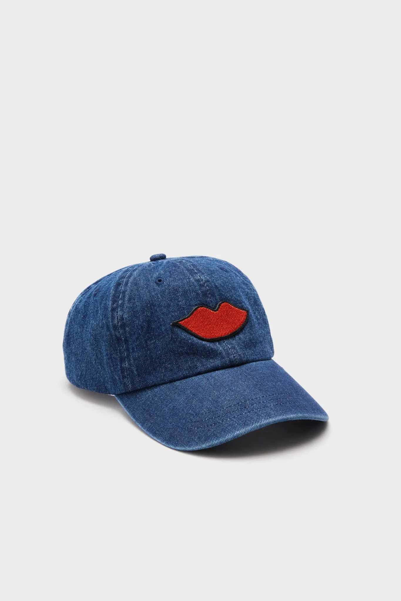 Denim with Lips Patch Baseball Hat sold by Tuckernuck