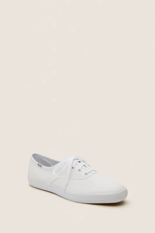 White Champion Canvas Sneakers sold by Tuckernuck