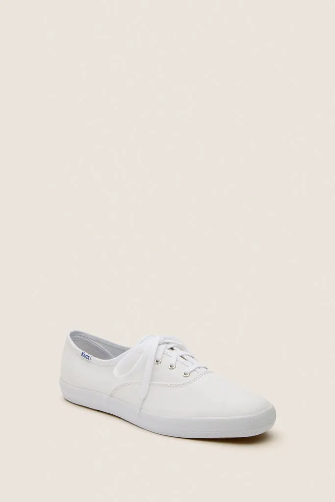 White Champion Canvas Sneakers sold by Tuckernuck