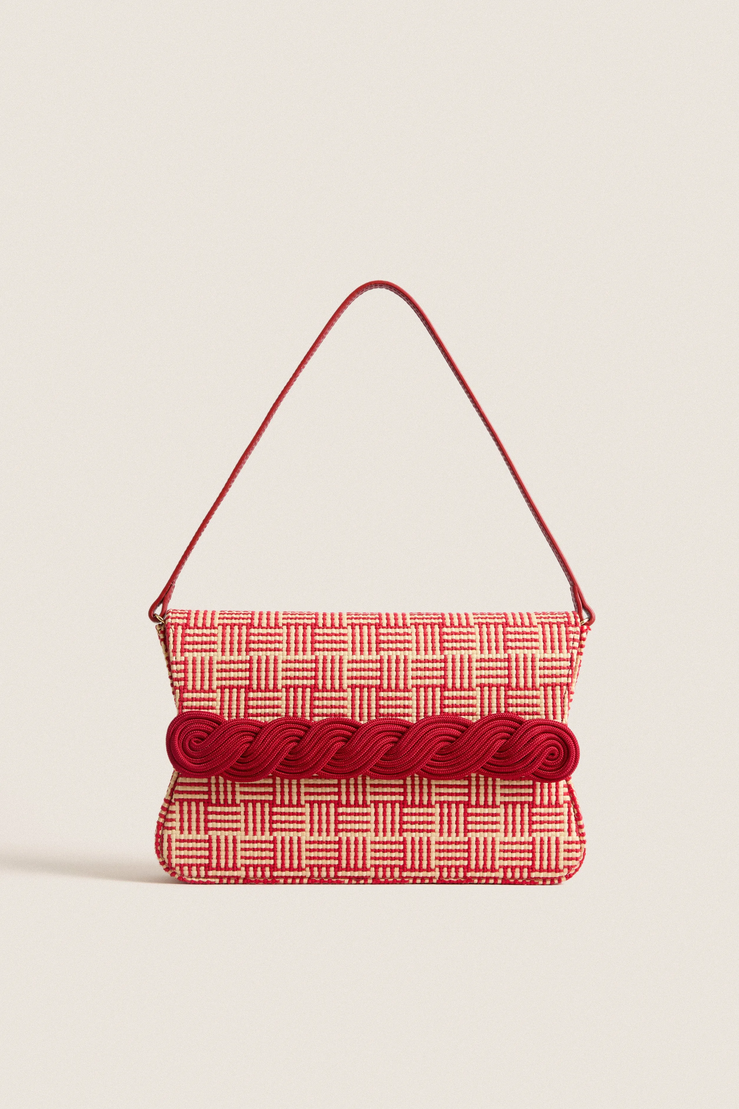 Natural and Red Gerrit Straw Clutch sold by Tuckernuck