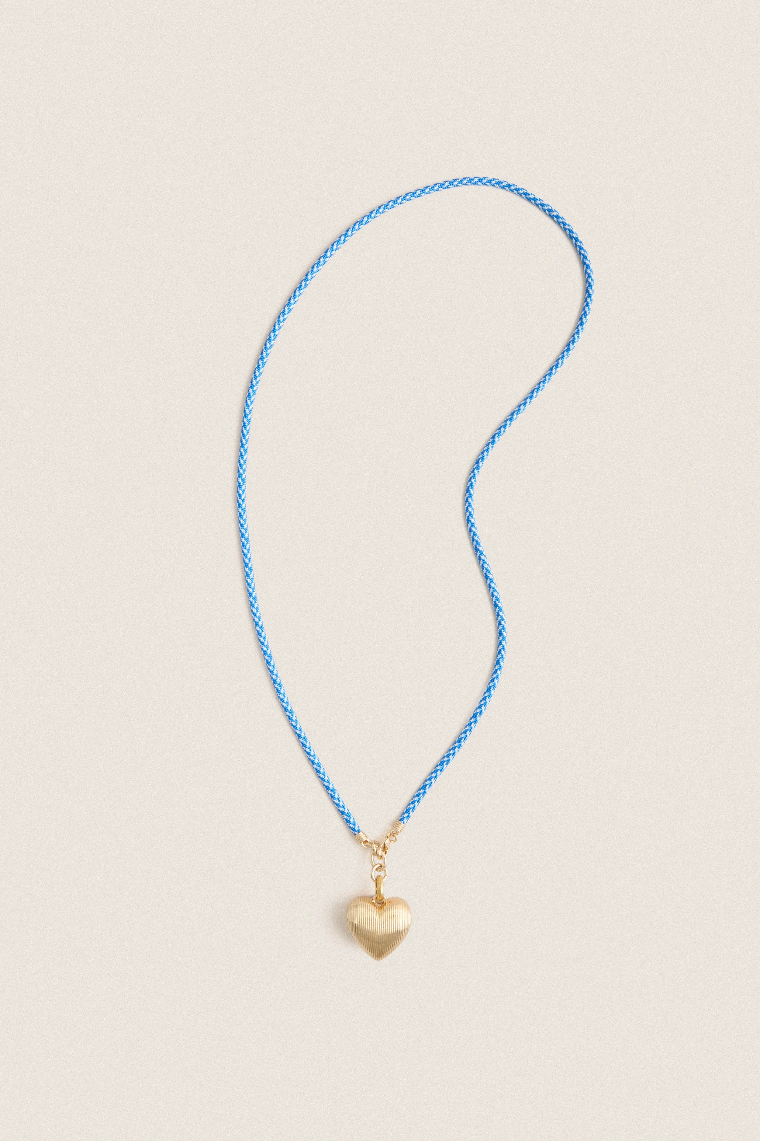 Gold, Blue and White Long Happy Cord Necklace with Heart sold by Tuckernuck