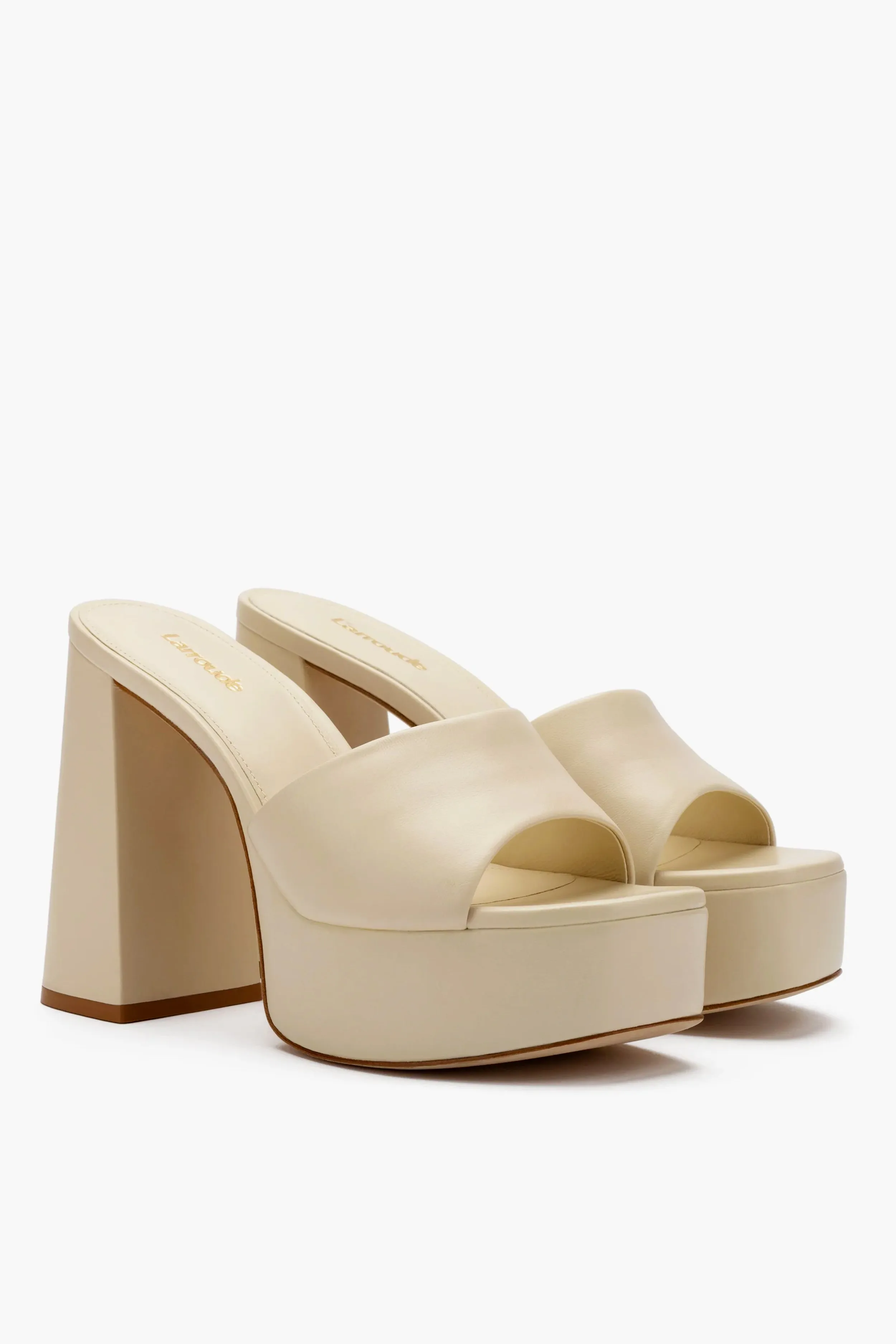 Ivory Leather Dolly Mules sold by Tuckernuck