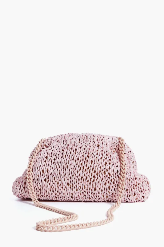 Pale Pink Raffia Game Clutch sold by Tuckernuck