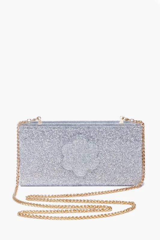 Silver Sparkle Flower Clutch sold by Tuckernuck