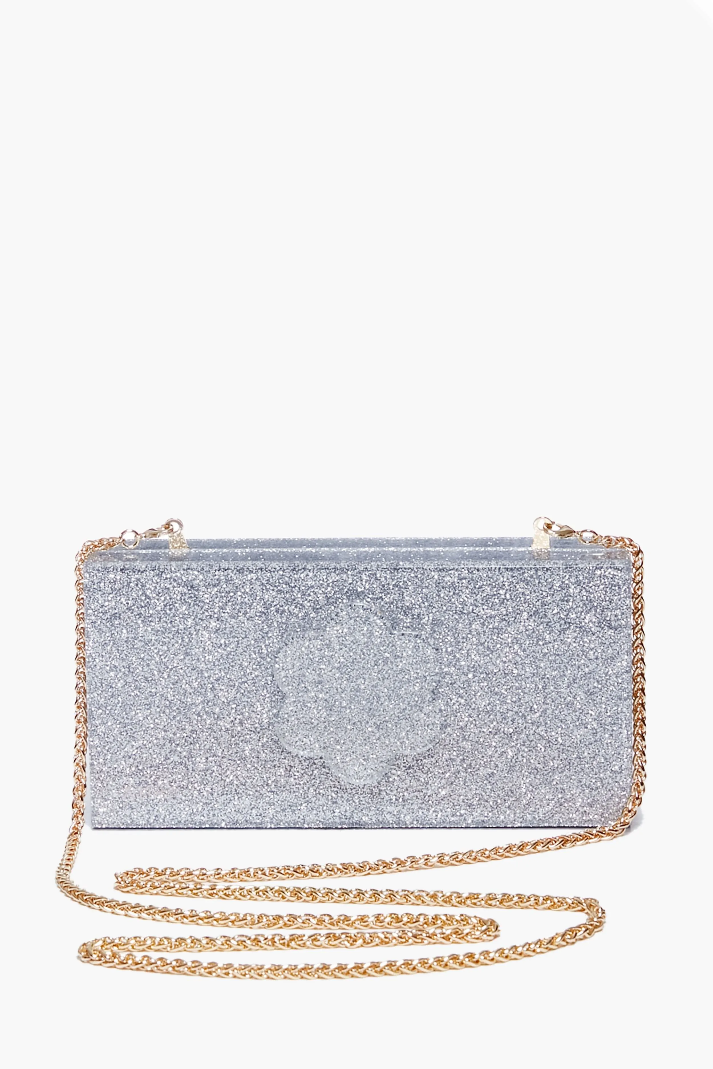 Silver Sparkle Flower Clutch sold by Tuckernuck