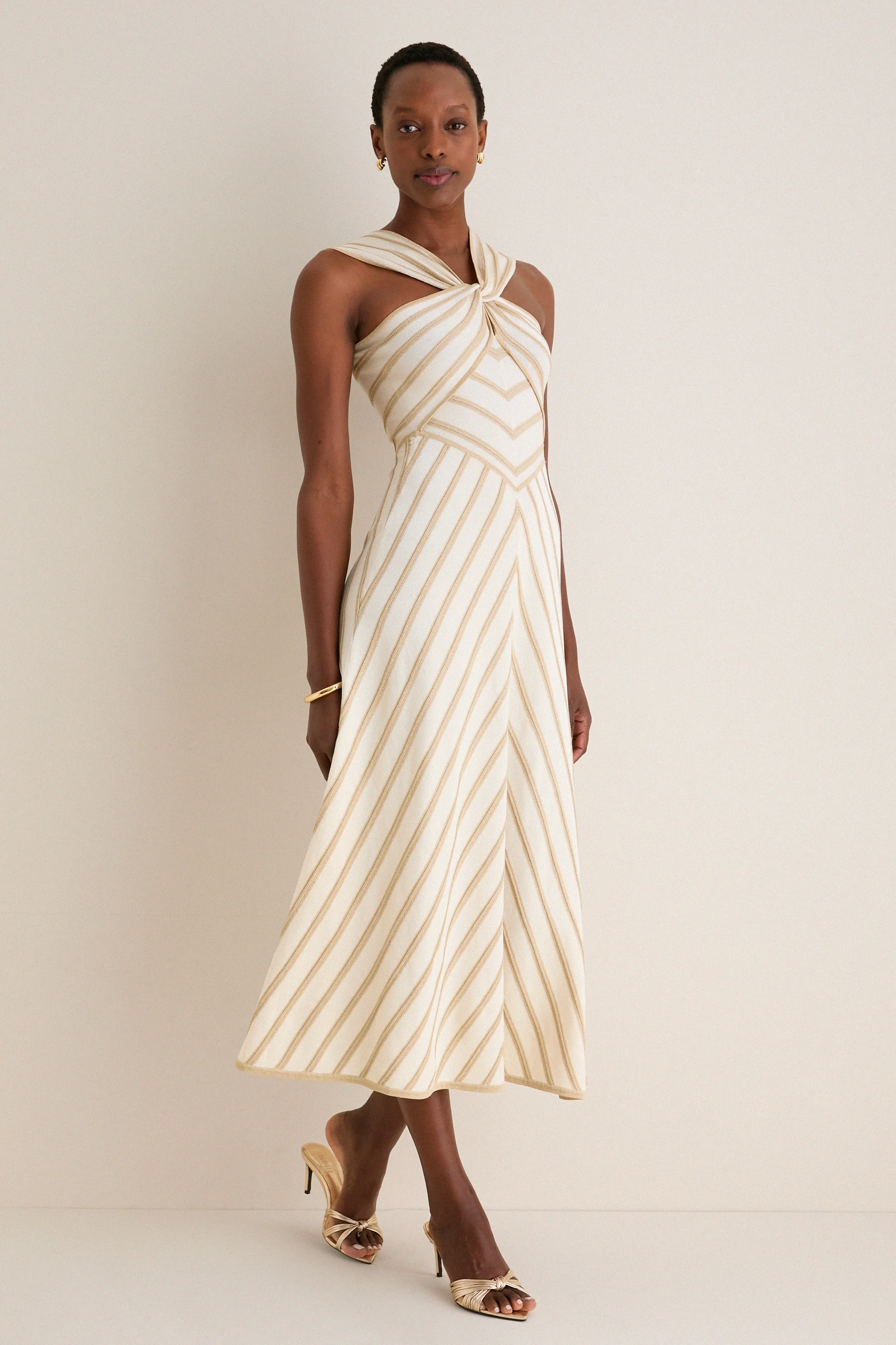Cream and Gold Luna Metallic Halter Dress sold by Tuckernuck