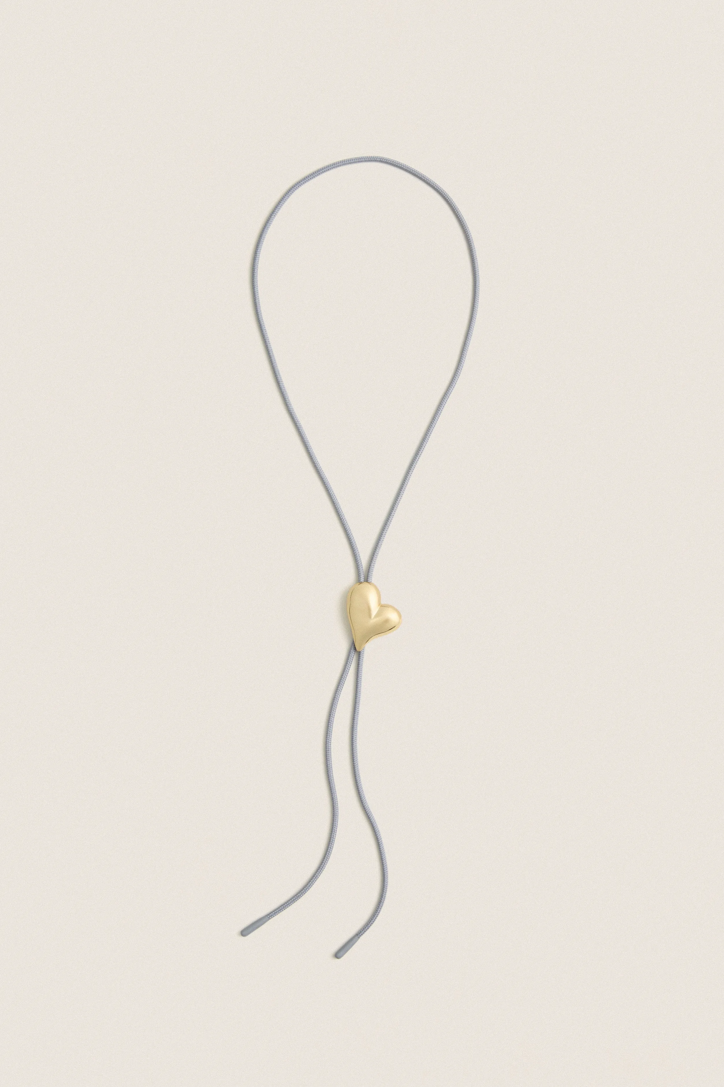 High Polish Gold Art Heart Bolo Tie sold by Tuckernuck