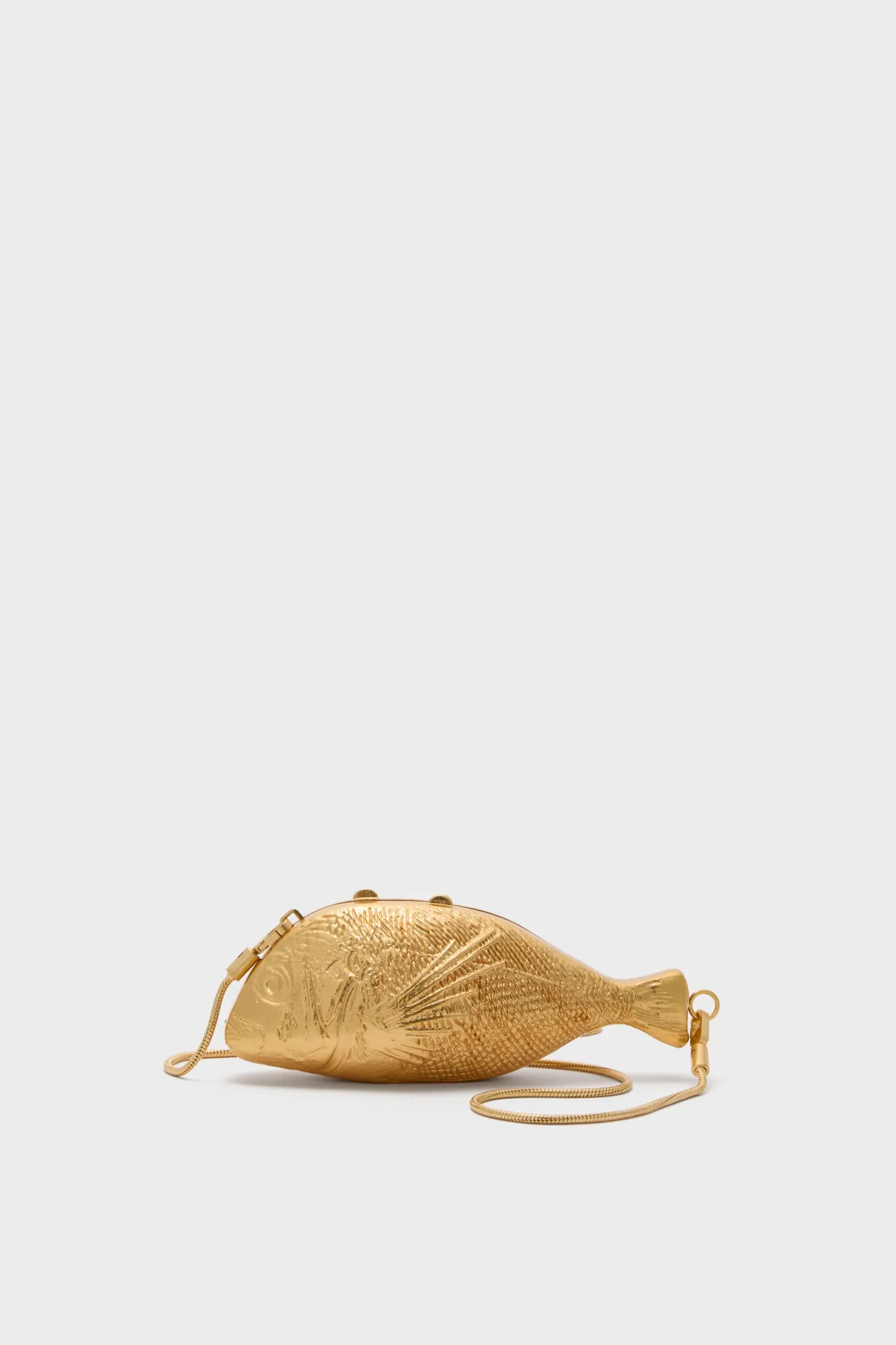 Gold Splash Metal Clutch sold by Tuckernuck