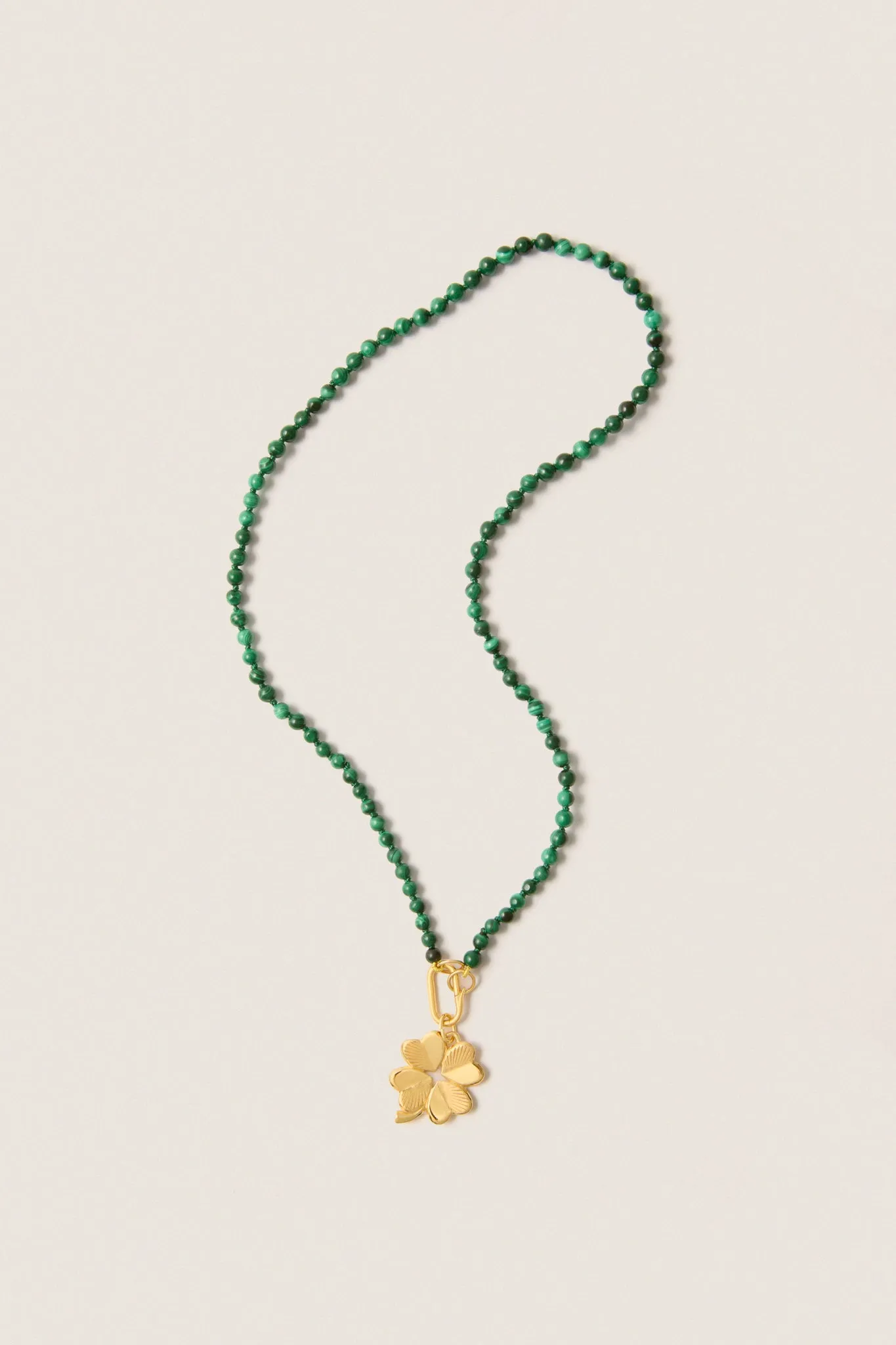 Malachite Knotted Gemstone Strand with Small Luck and Love Clover sold by Tuckernuck