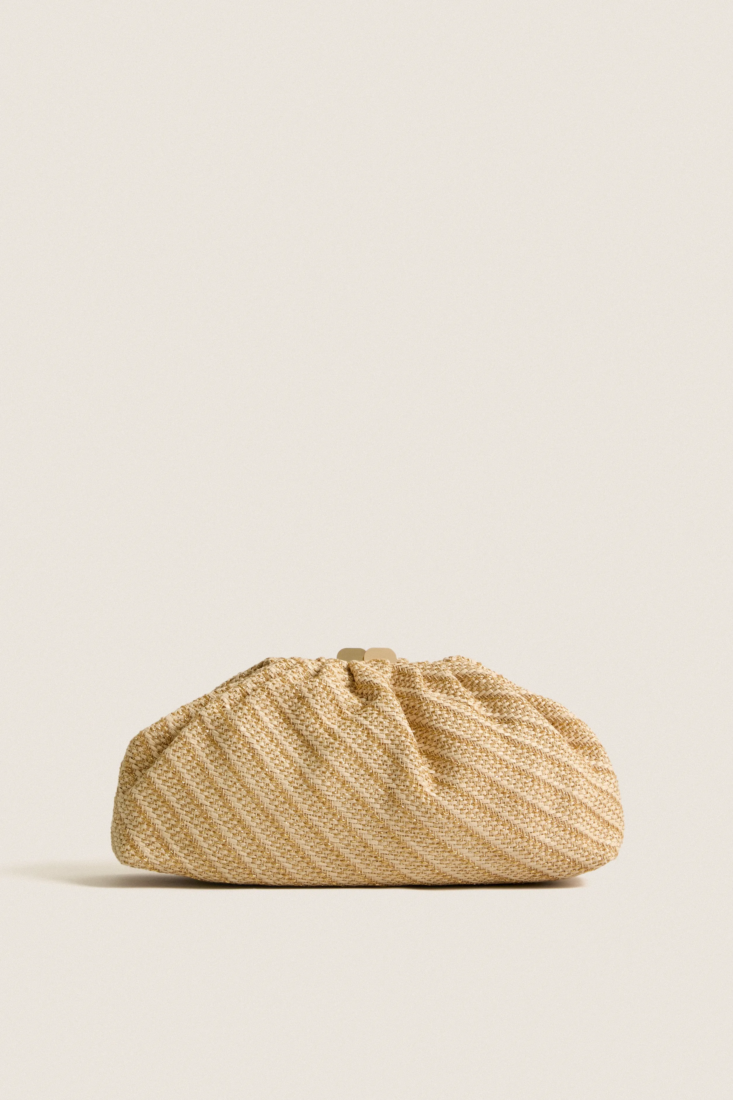 Natural Gold Brisa Clutch sold by Tuckernuck