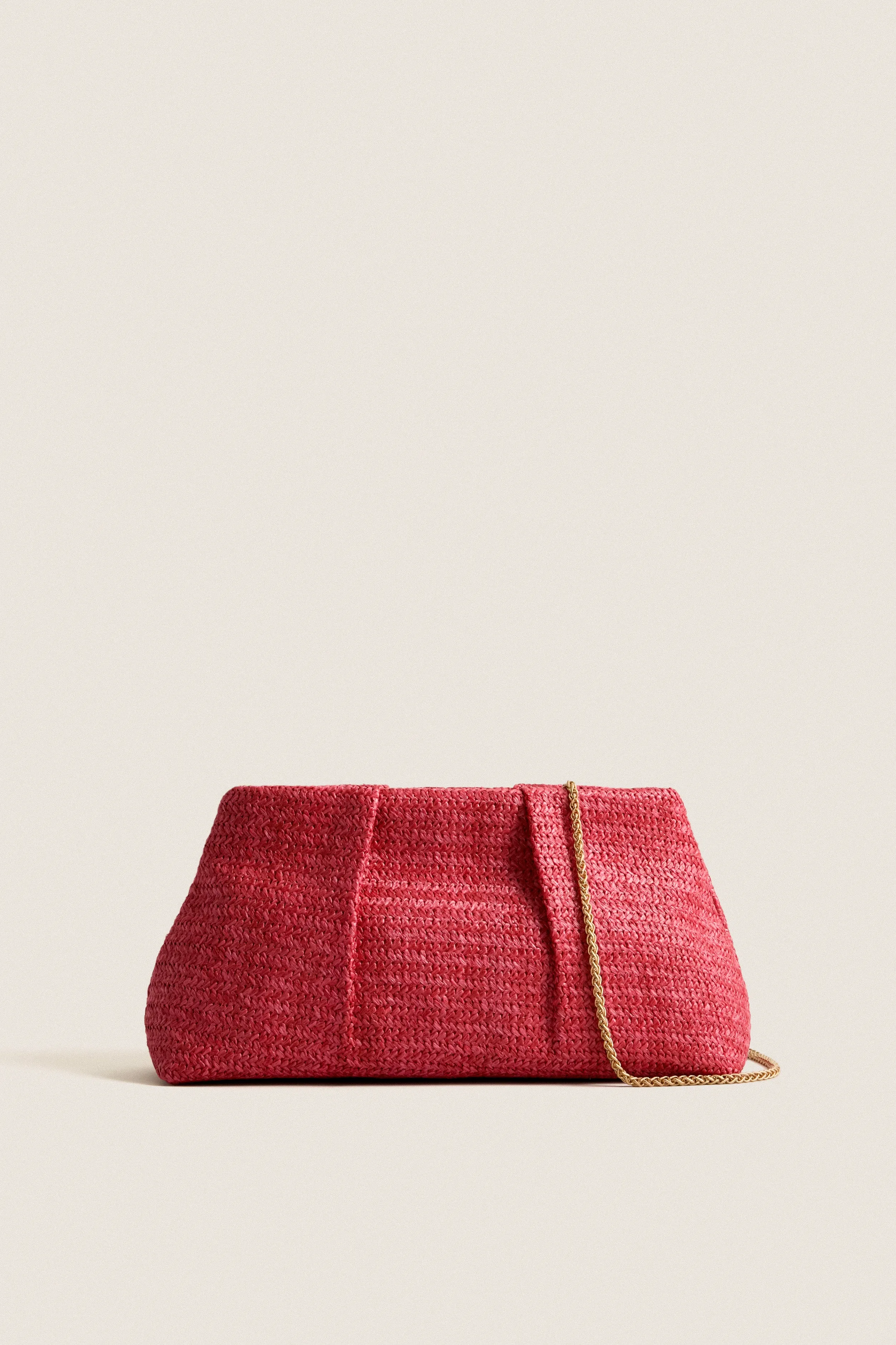 Coral Breeze Clutch sold by Tuckernuck
