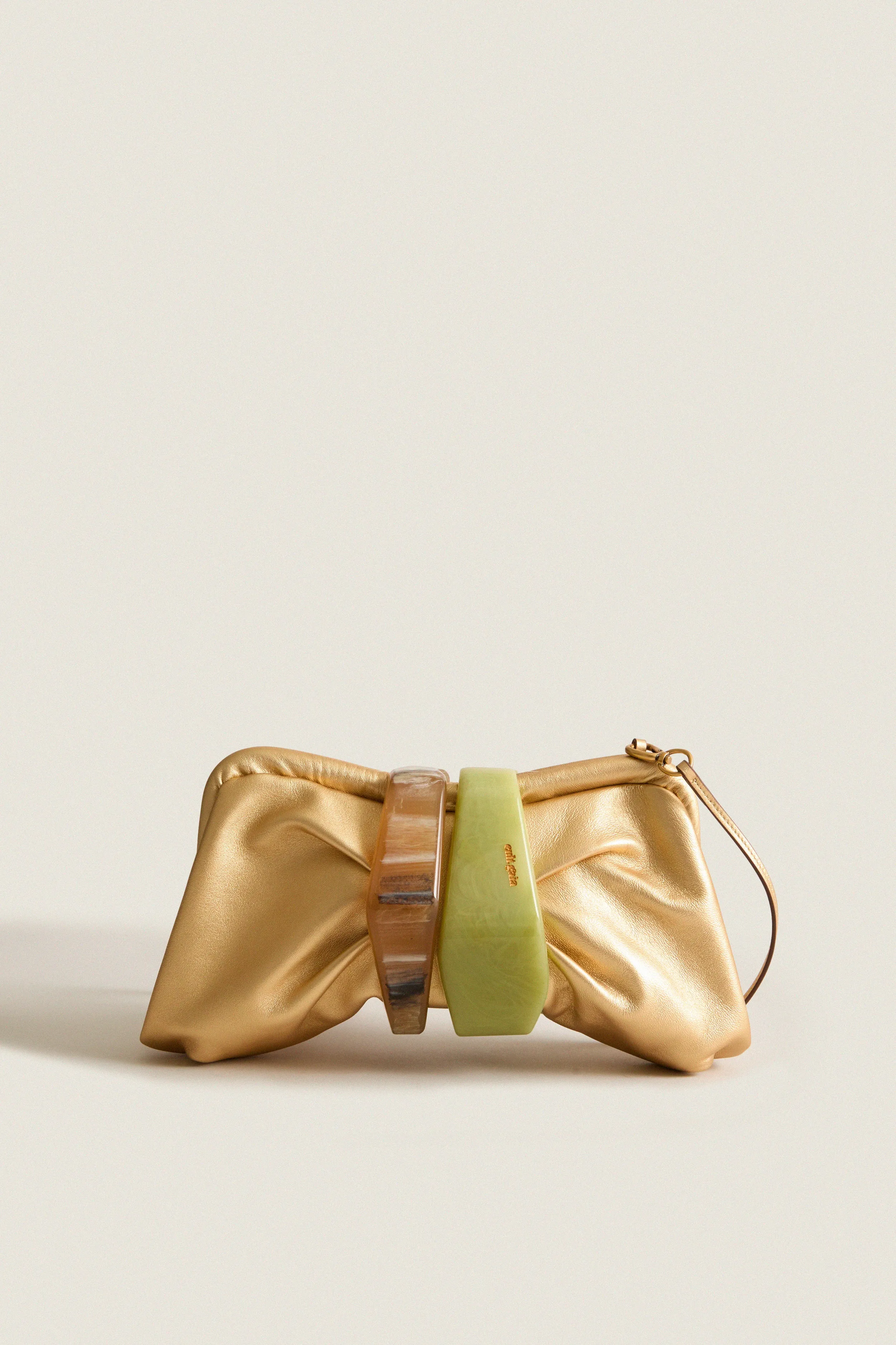 Brass Julita Clutch sold by Tuckernuck