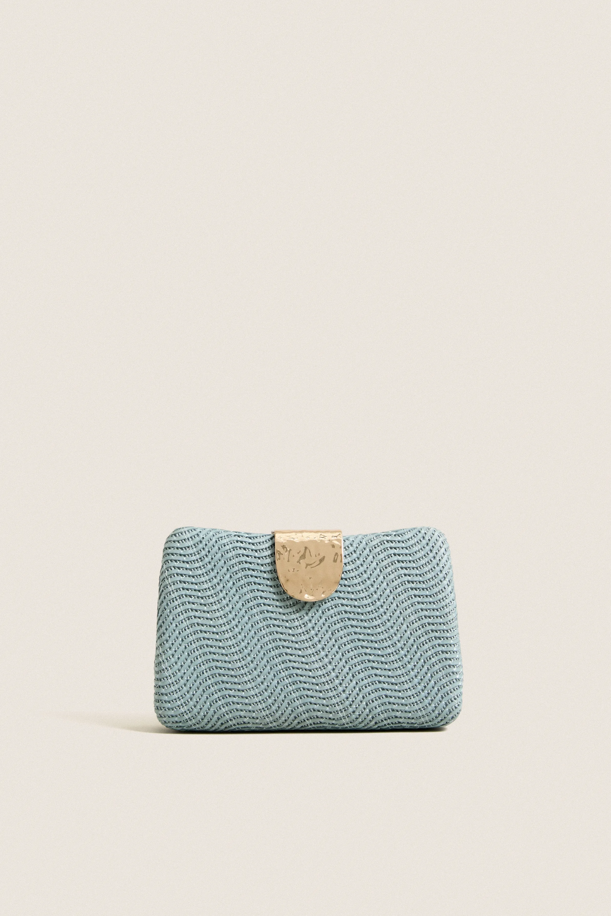 Blue Lindy Woven Clutch sold by Tuckernuck