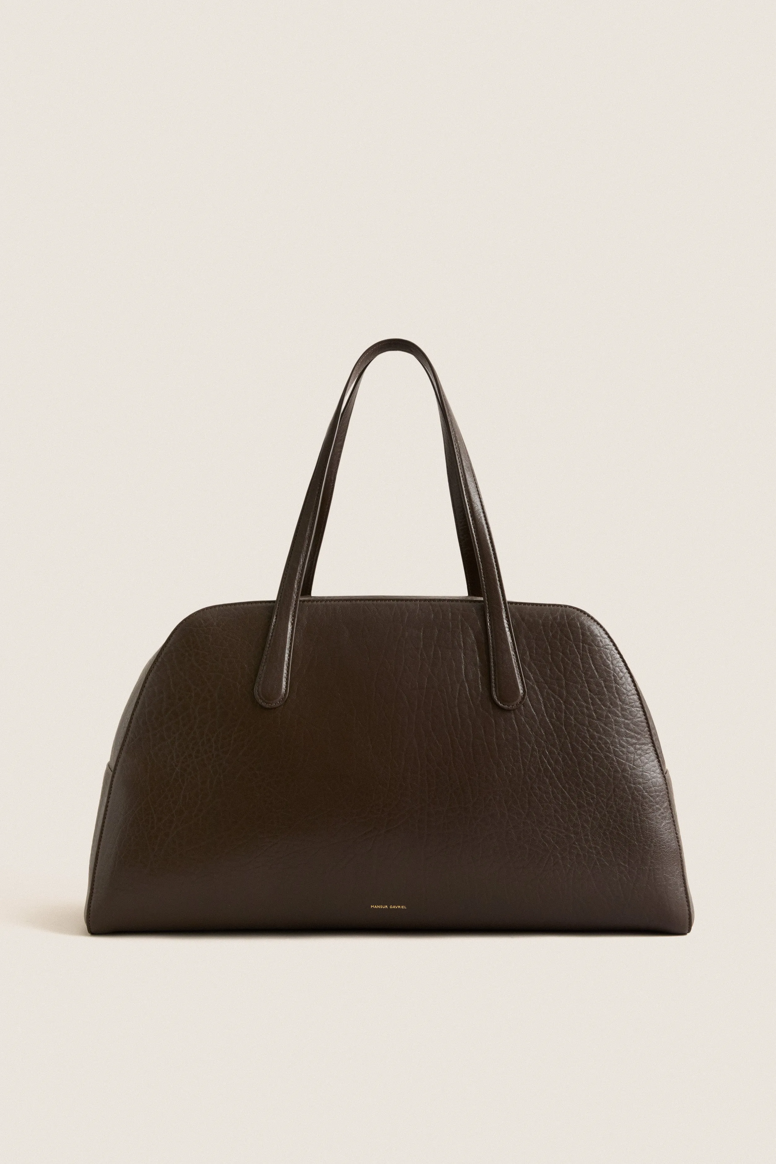 Ebony Helios Travel Bag sold by Tuckernuck