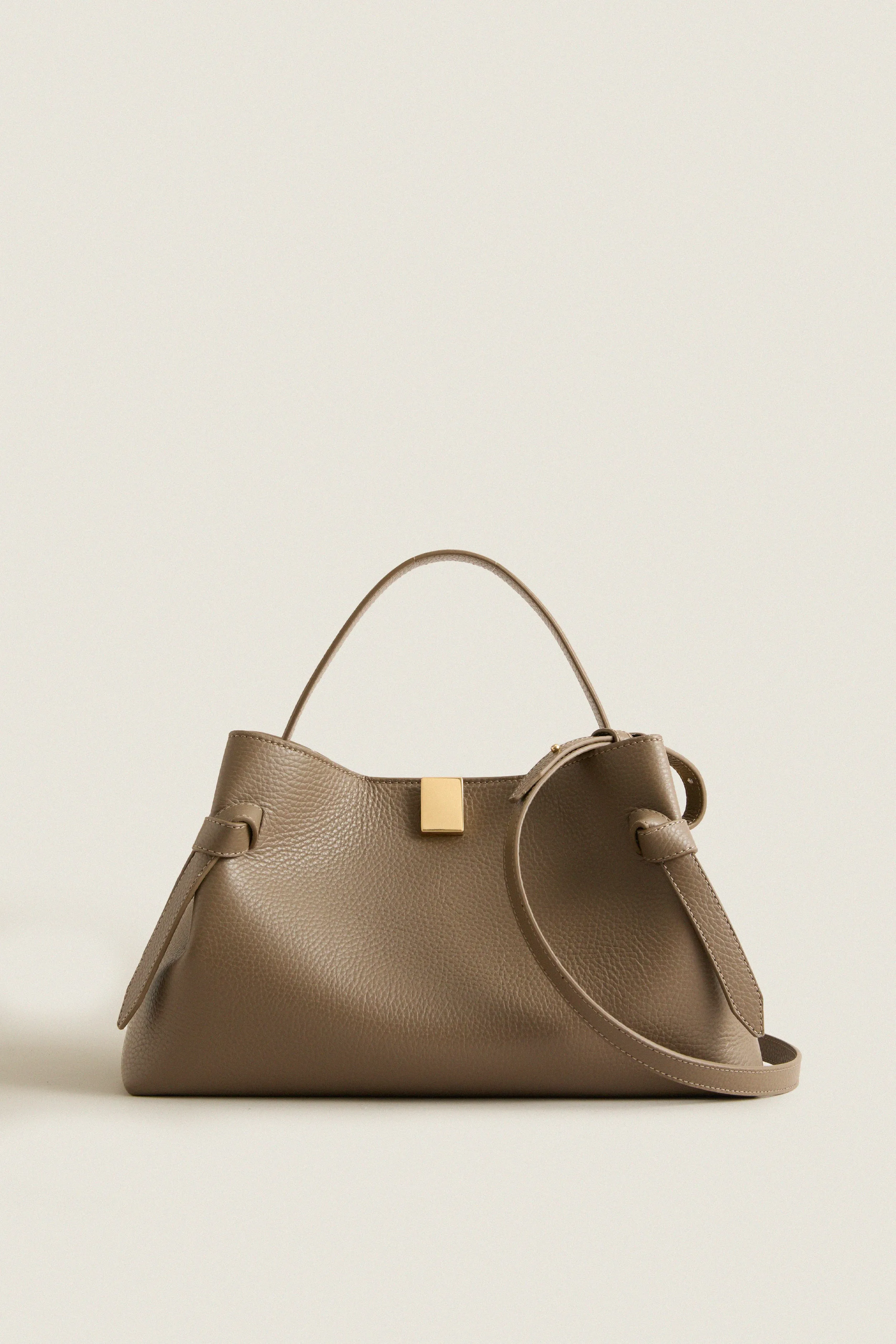 Taupe Pebble Grain Leather Gyoza Bag sold by Tuckernuck