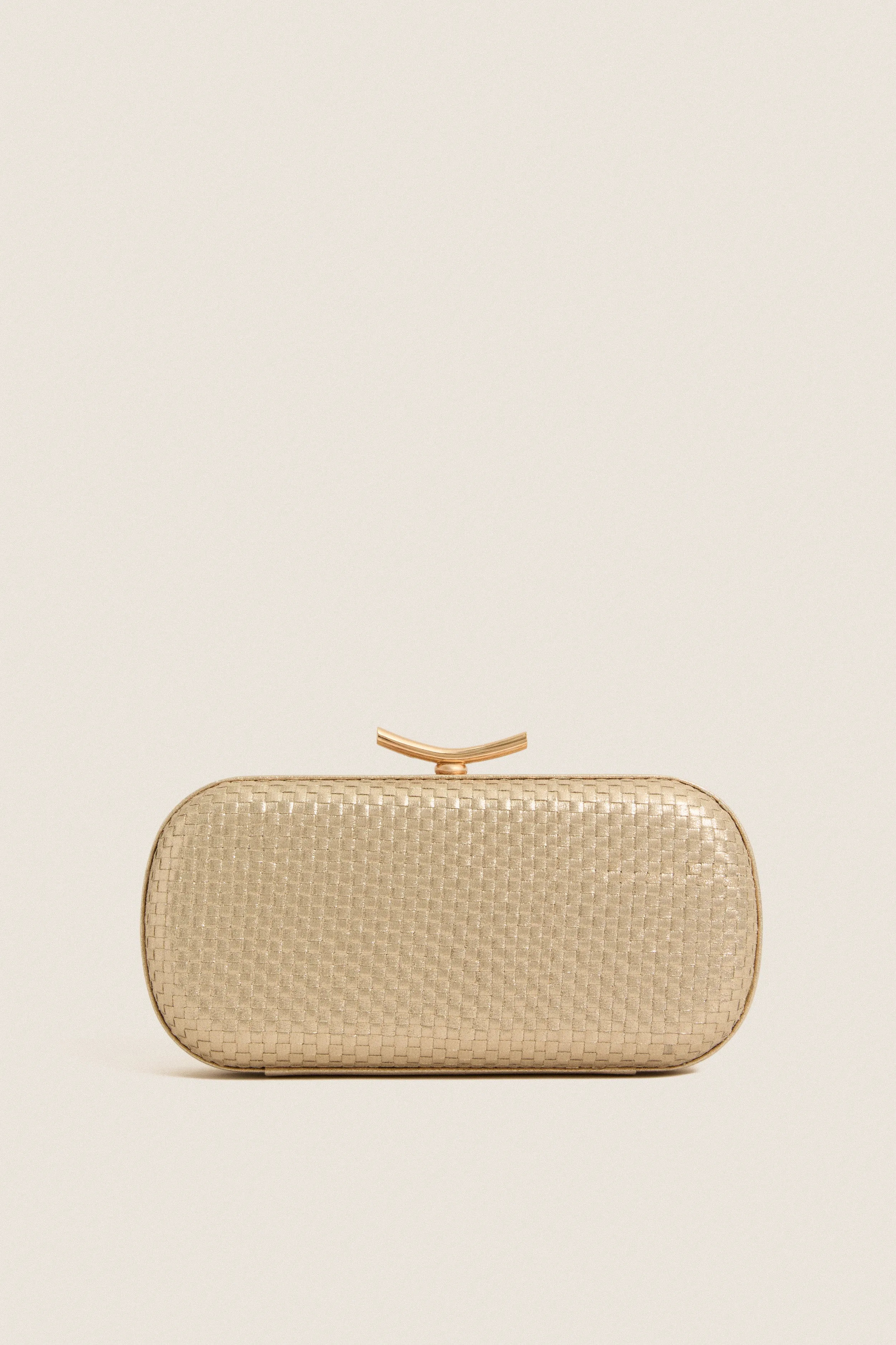 Gold Victoria Clutch sold by Tuckernuck