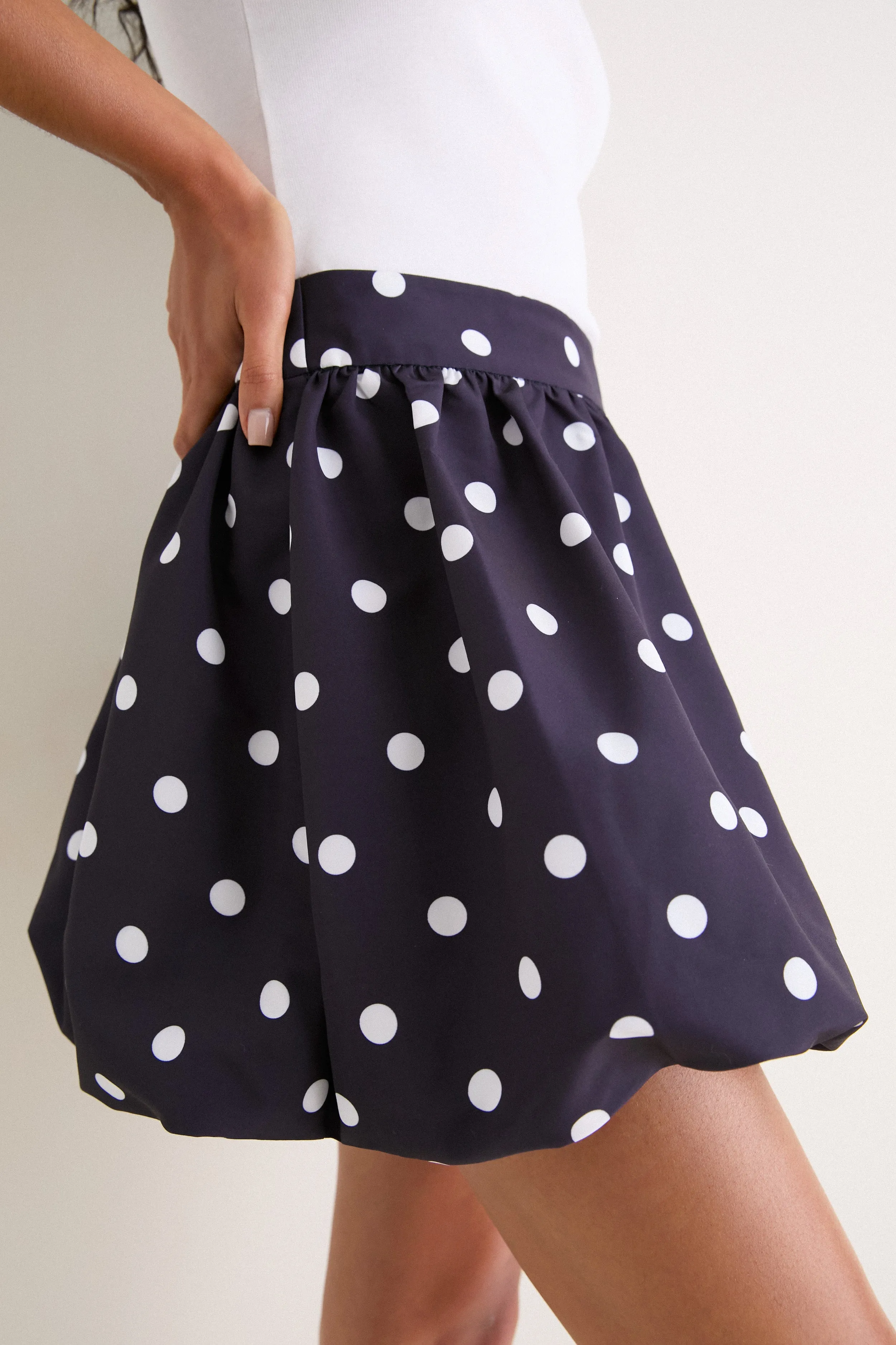Navy & Ivory Polka Dot Zoe Bubble Mini Skirt sold by Tuckernuck product image thumbnail 5