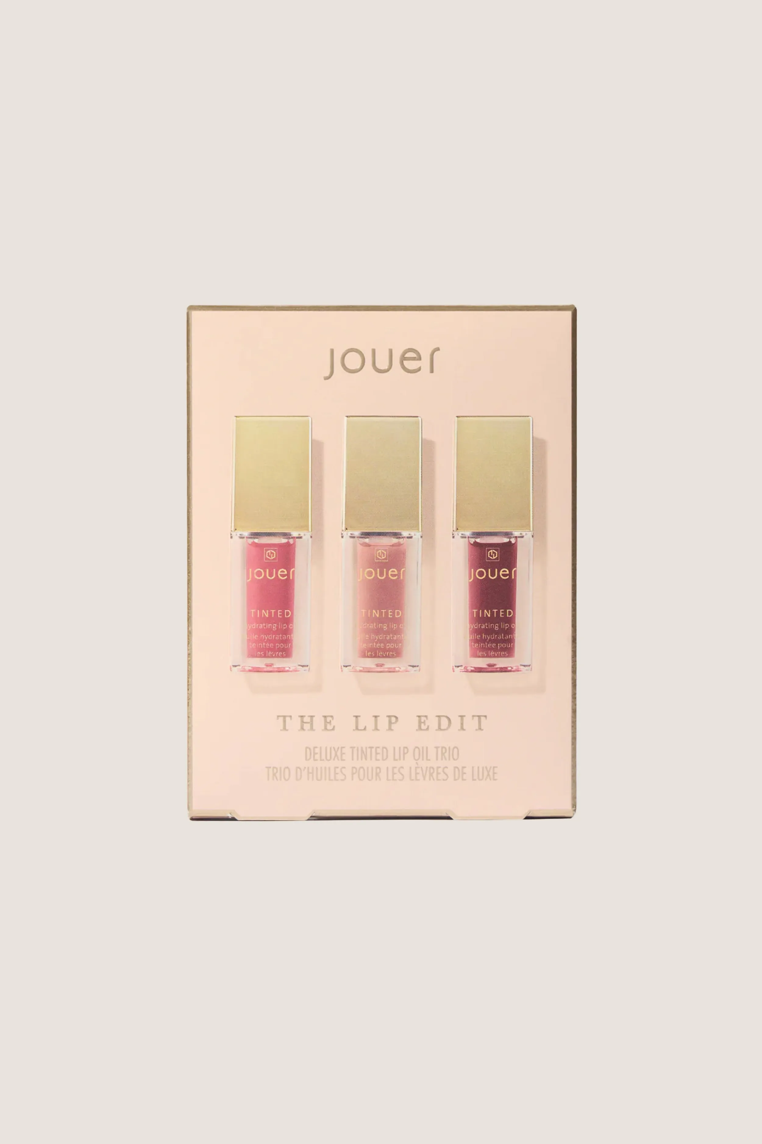 The Lip Edit Deluxe Tinted Lip Oil Trio sold by Tuckernuck