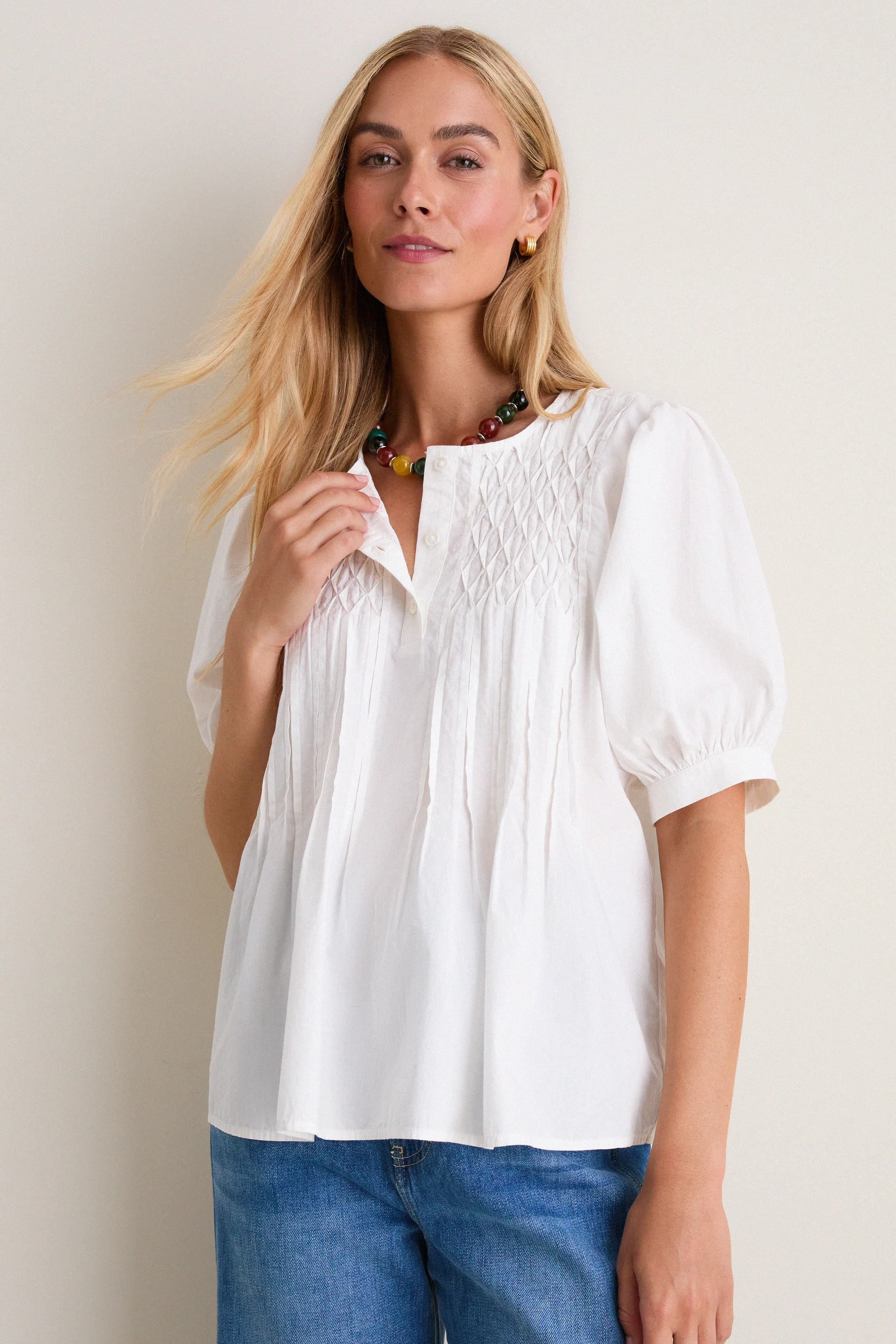 White Cotton Hand-Smocked Aurora Top sold by Tuckernuck