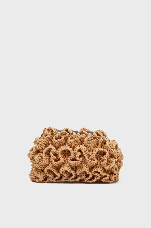 Sand Dahlia Clutch sold by Tuckernuck