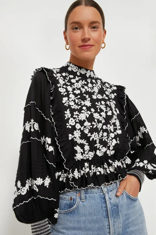 Black Embroidered Ruffle Long Sleeve Blouse sold by Tuckernuck