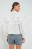 Off White Smocked Yoke 3D Flower Blouse sold by Tuckernuck