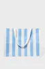 Mid Blue Stripe Carryall Beach Bag sold by Tuckernuck