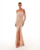 Spectacular sequined maxi dress in gold sold by Milla