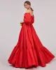 Carmen puffy dress with voluminous off-the-shoulder sleeves sold by Milla