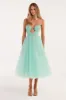 Mint green tender midi tulle dress sold by Milla