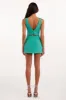 Glossy ultra mini dress in mint green with cutouts sold by Milla