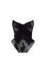 Black lace over the white mesh peplum corset with an oversized bow, Parisienne sold by Milla