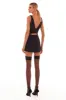 Glossy ultra mini dress in black with cutouts sold by Milla