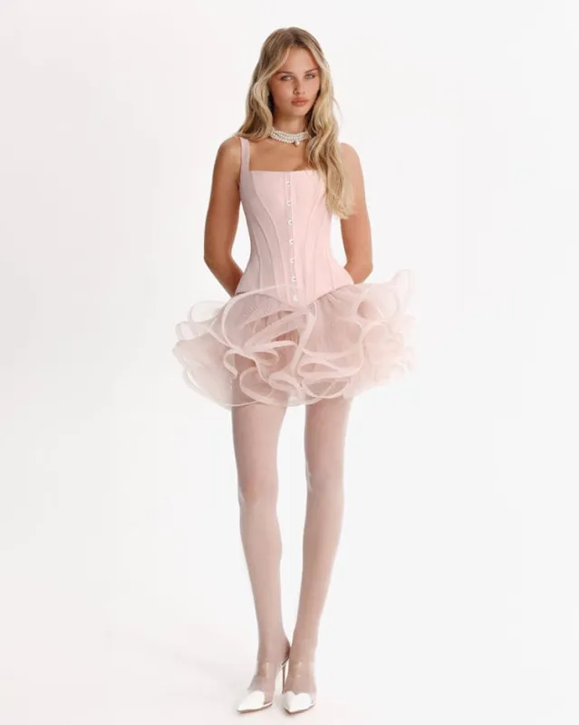 Sculptural flower-like pink mini skirt sold by Milla