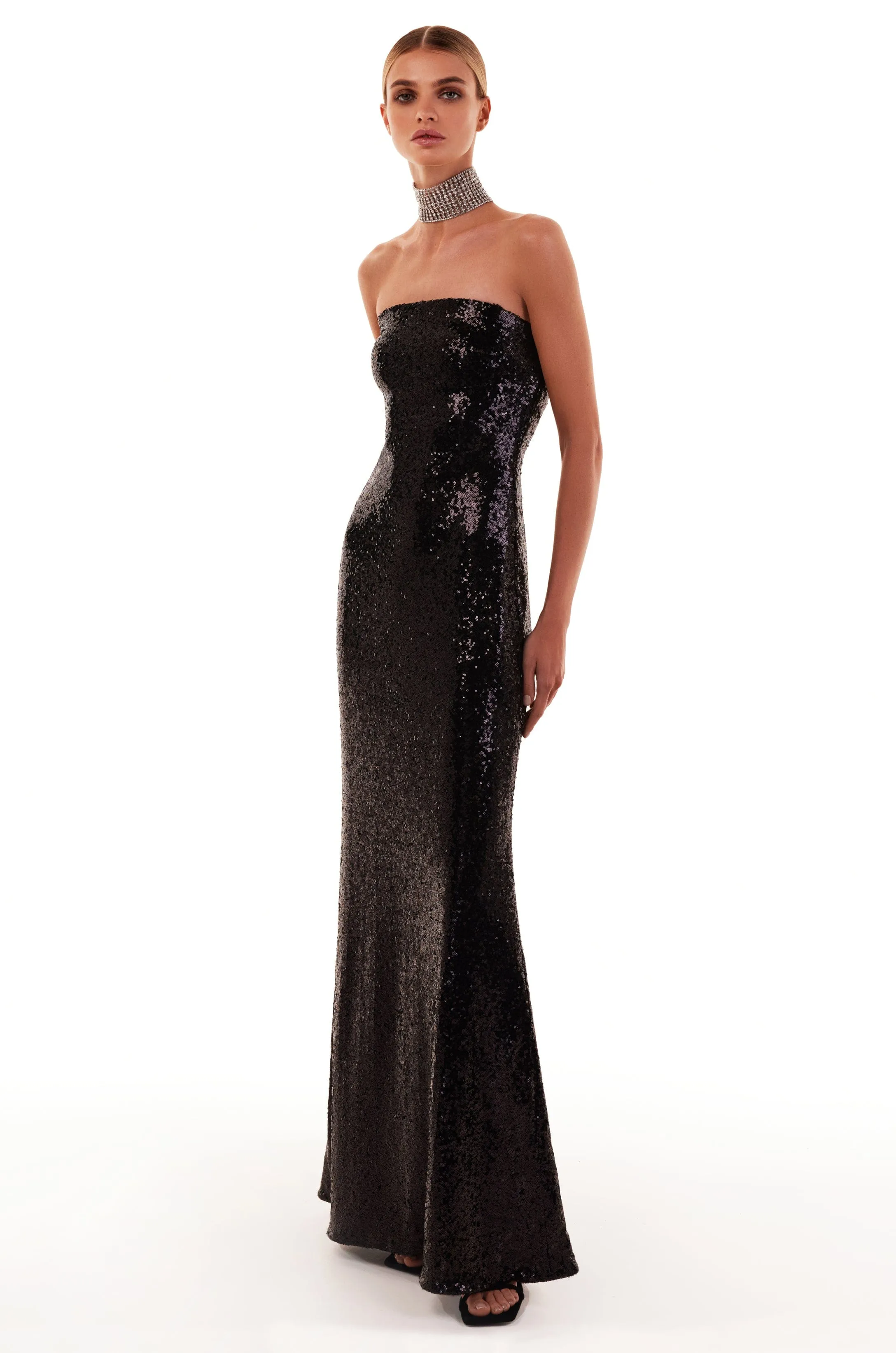 Sequined strapless maxi dress in black sold by Milla