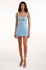 Glossy ultra mini dress in light blue with cutouts sold by Milla