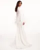 Delicate feather-trimmed satin robe sold by Milla