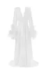 Delicate feather-trimmed satin robe sold by Milla